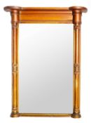 A George IV giltwood pier mirror, circa 1825, with split column side pilasters and frieze, reeded