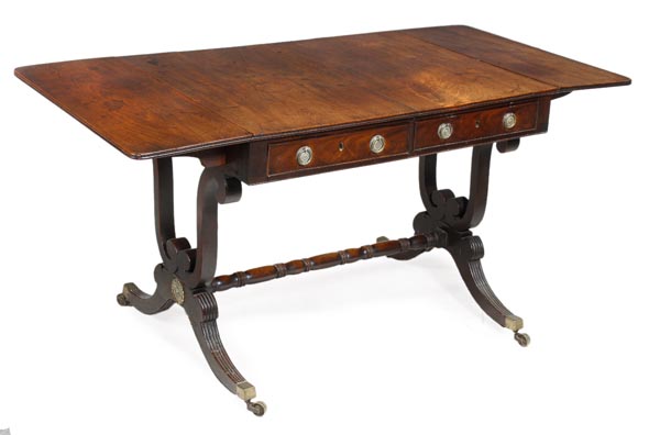 A Regency mahogany rectangular sofa table, circa 1815, two frieze drawers with false opposing