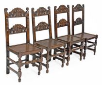 A matched set of four oak backstools in Charles II style, rectangular backs with scroll and mask