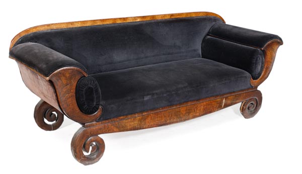 A South German Biedermeier walnut sofa, second quarter 19th century, arched rectangular back,