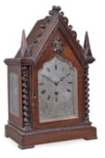 A William IV Gothic revival small carved oak library timepiece Frodsham, London, circa 1830 The