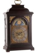 A rare ebonised Dutch striking bracket clock with moonphase and alarm Signed for John Waliso,