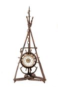 A desk-top timepiece, with a white enamel dial, the brass framework representing oars, pennant,