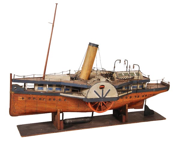 A plank-on-frame model of a paddle steamer, circa 1920, with paddle wheels, funnel, mast, life-