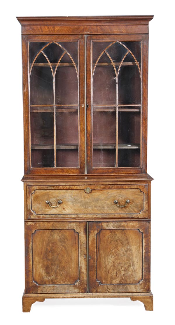 A George III mahogany secretaire bookcase, circa 1800, upper section with moulded cornice, pair of