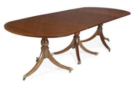 A mahogany triple pedestal dining table in George III style, 20th century, each D-shaped end