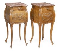 A pair of French walnut and marble mounted bedside cupboards, 20th century, serpentine sided rouge