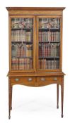 An Edwardian mahogany and satinwood banded cabinet on stand, circa 1910, dentil moulded cornice,