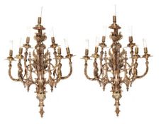 A pair of substantial Continental gilt metal seven light wall appliques, late 19th century, the urn