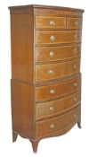 A mahogany and satinwood crossbanded bowfront chest on chest, first half 19th century, moulded