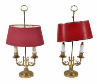 A pair of brass ‘Bouillotte’ lamps, 20th century, each with twin scrolling branches, one fitted