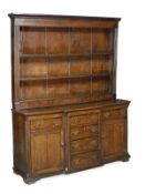 A oak breakfront dresser, late 18th/19th century, moulded cornice, three open shelves and five