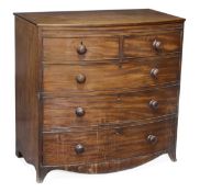 A Regency mahogany bowfront chest of drawers, circa 1815, brushing slide above two short and three