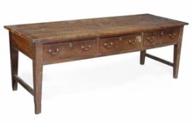 A George III oak serving table, circa 1780, probably North Country, plank top with cleated ends,
