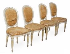 A set of four Louis XVI cream painted and parcel gilt side chairs, circa 1750, oval backed