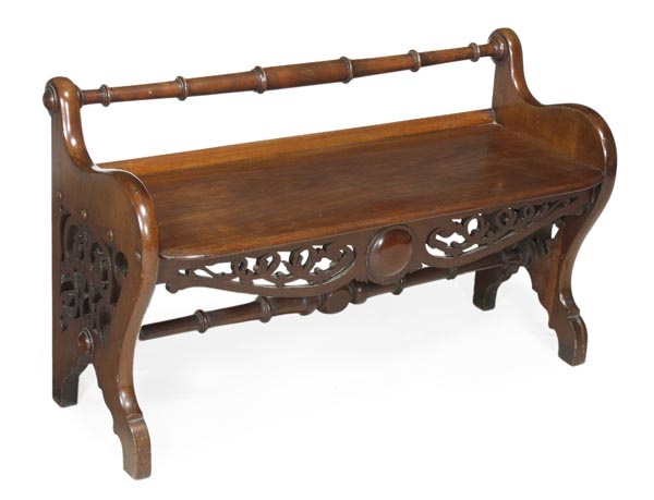 A Victorian mahogany hall bench, circa 1870, solid seat, with a turned rear rail, shaped trestle