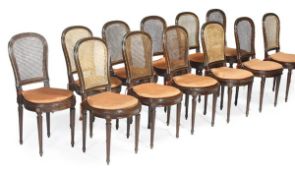 A set of twelve mahogany and brass mounted dining chairs in early 19th century style, circa 1900,