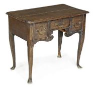 A George II oak side table, circa 1740, rectangular twin plank top, an arrangement of three small