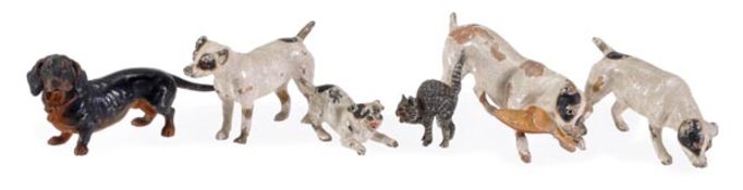 Six Austrian cold painted bronze models of dogs and a cat, late 19th/early 20th century, comprising