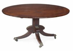 A Regency mahogany circular dining table, circa 1815, crossbanded top, above a square section