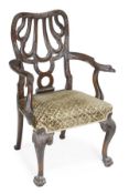 A carved oak armchair, in George II style, last quarter 19th century, shaped and pierced