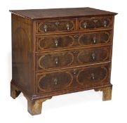 A George II walnut chest of drawers, circa 1740, rectangular top quarter veneered, line inlaid and