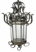 A patinated bronze and bevelled glass hall lantern, 20th century, of hexagonal section, the upper