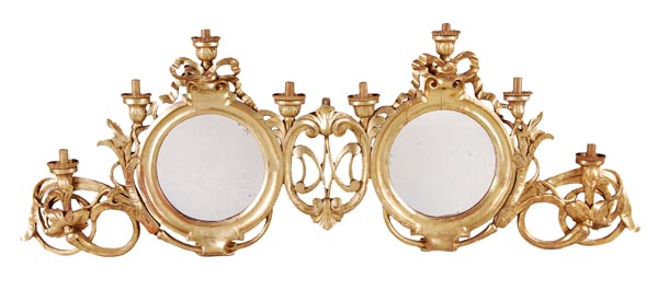 An Italian carved and giltwood framed double girandole, 19th century, the two circular mirrors