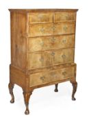 A George II walnut chest on stand, circa 1740, moulded top, two short above four long drawers, on