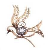 A bird brooch, the pierced bird with a rose cut diamond cluster body and scrolled wings, length