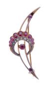 A ruby and diamond crescent brooch, the crescent set with graduated oval-cut rubies with rose cut