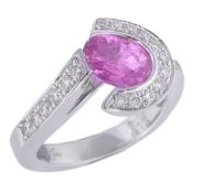 * A pink sapphire and diamond ring, the ring set with an oval cut pink sapphire in a brilliant cut