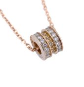 * A diamond and yellow stone pendant, the bead pendant set throughout with brilliant cut diamonds