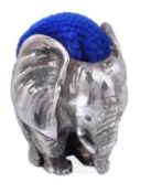 A silver novelty small elephant pin cushion, maker’s mark ‘IQ’?, London 1990, with a blue cushion,