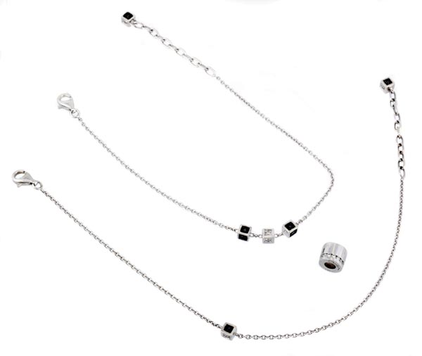 * A diamond pendant, the bead style pendant set with brilliant cut diamonds; a belcher link diamond