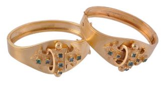 A pair of Victorian hinged bangles, the bangles with applied shaped and scrolled plaques with