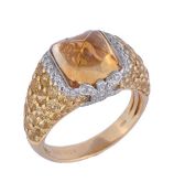 * A citrine and yellow diamond ring, the ring set with a pyramid shaped citrine and with brilliant