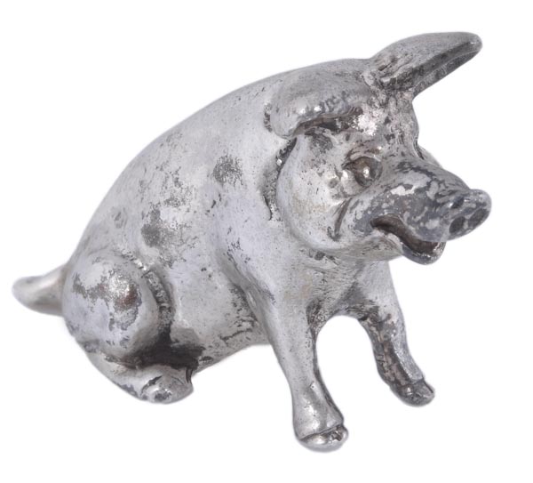 A silver small figure of a pig, maker’s mark ‘J S & M J’, (not traced), London 1984, seated, 2.