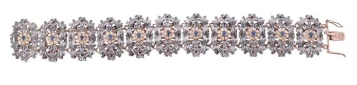 A sapphire bracelet, composed of eleven open work oblong links centrally set with a circular cut