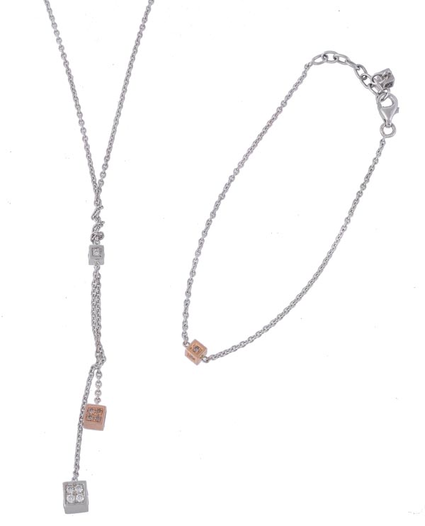 * A diamond necklace and bracelet, the belcher link chain with two hanging cubes set with brilliant