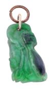 A carved jadeite pendant, the jadeite plaque carved as a fish beside a lily, 2.1cm long. The