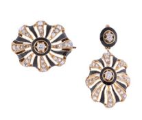 A diamond and black enamel pendant and brooch, the matching oval pierced pendant and brooch set