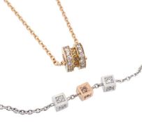 * A diamond and yellow stone pendant, the bead pendant set with brilliant cut diamonds and round
