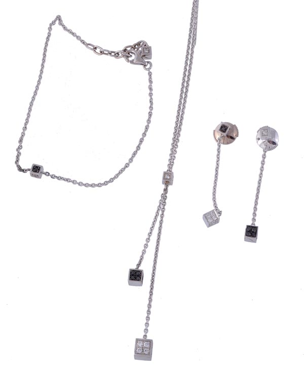 * A diamond and black diamond necklace, the belcher link chain with two hanging cubes set with