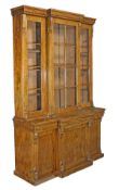 A Victorian mahogany breakfront library bookcase, circa 1860, moulded cornice, astragal glazed