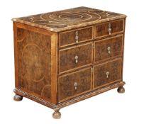 A William and Mary olive oyster veneered and holly crossbanded chest of drawers, circa 1690,