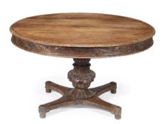 A William IV Anglo-Indian dining table, circa 1835, circular top, acanthus carved frieze, gadrooned