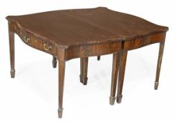 A mahogany dining table in George III style, circa 1900, each end of serpentine outline, each end