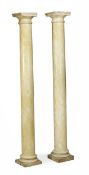 A pair of composition simulated yellow marble columns, in George III style, approximately 232cm
