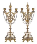 A pair of French gilt metal and alabaster mounted three light candelabra, circa 1880, the urn